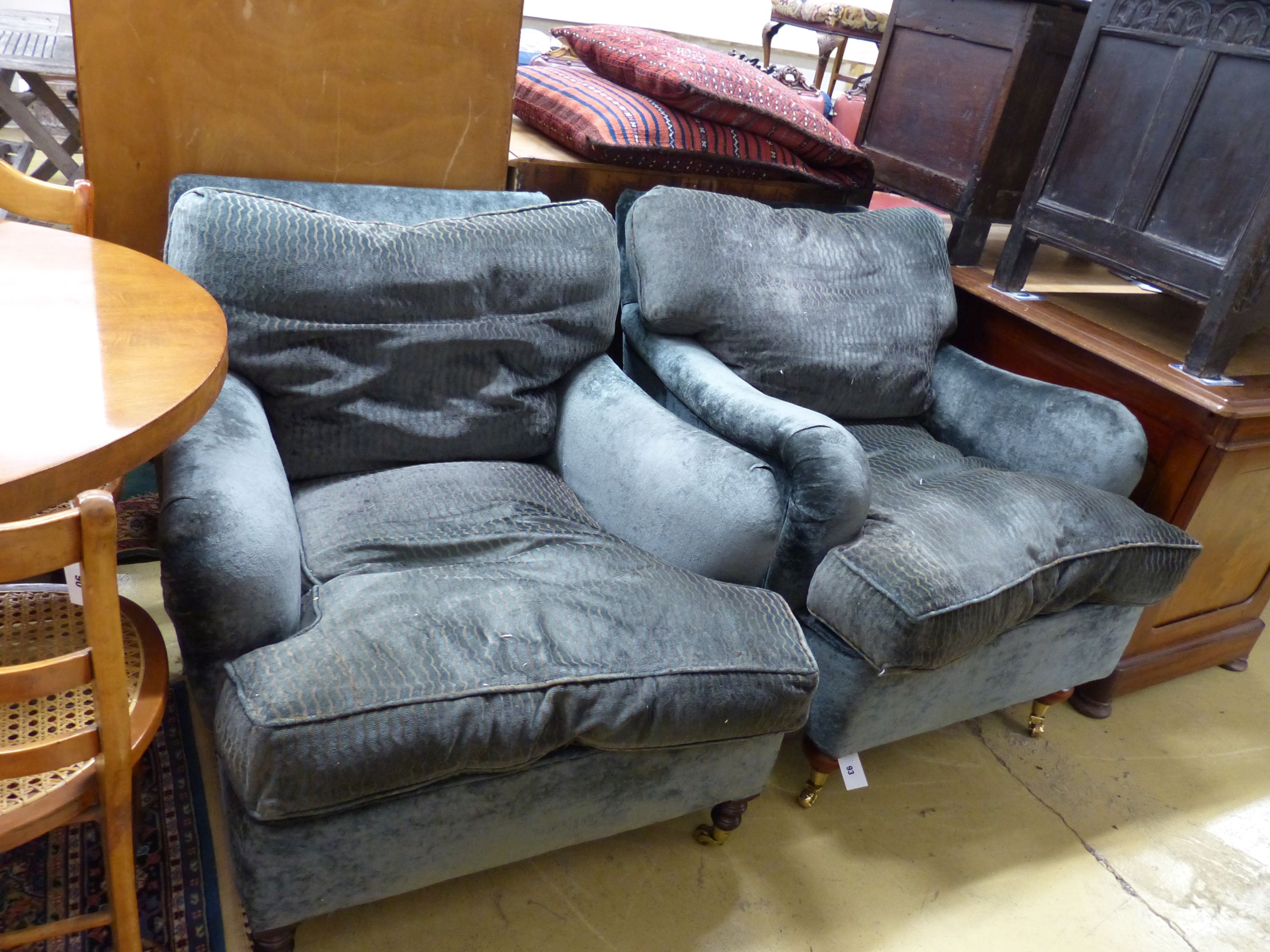 Two George Smith club armchairs in matching upholstery